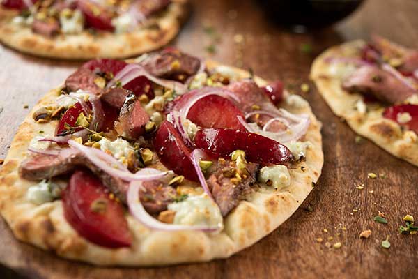 Summer Beef and Plum Pizzettes