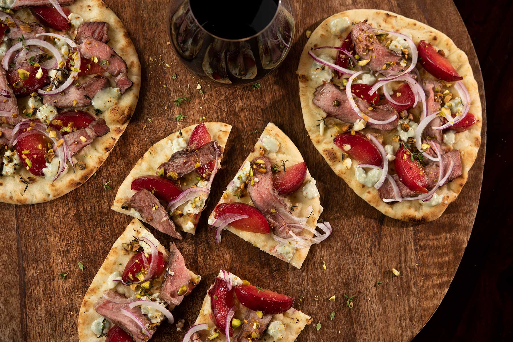 Summer Beef and Plum Pizzettes